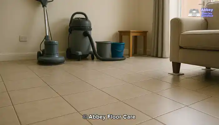 Tiled living area prepared for professional cleaning, with organised equipment and protected furniture in a North East England home.